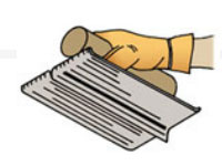 Use a 2x8 plank as a straightedge to guide a concrete groover.